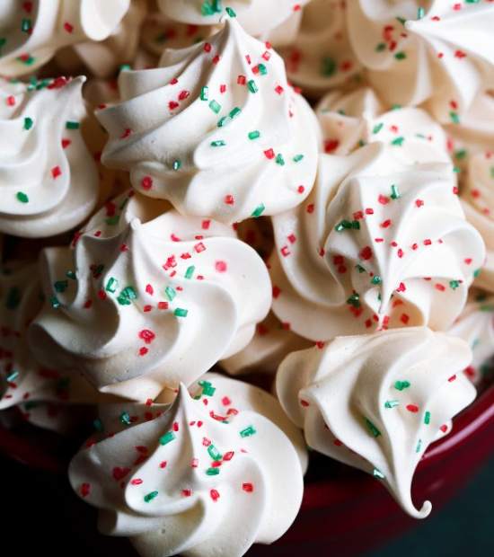 Simple cookies made from whipped egg whites with sprinkles.