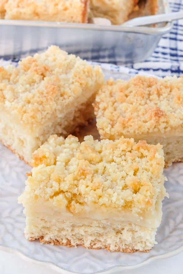 Cake with crumb and custard cut into squares.