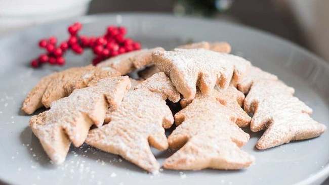 Christmas cookies in the shape of trees with coconut and oatmeal.