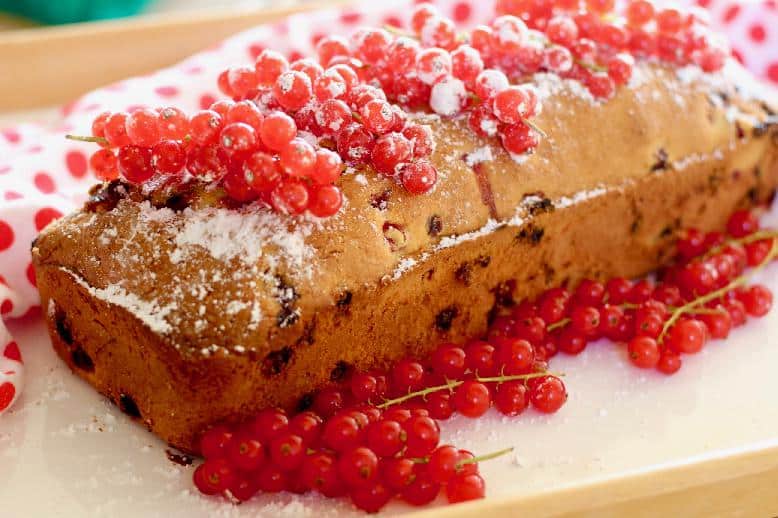 A sweet sandwich decorated with candied red currants.