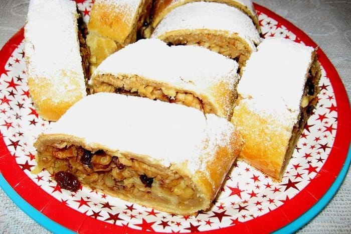 Christmas strudel with apples, nuts and raisins.