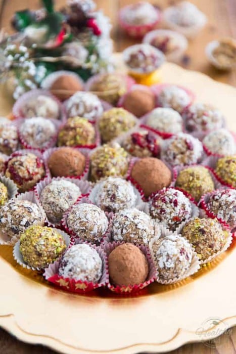 Christmas unbaked balls made of dried apricots, cranberries and coconut.
