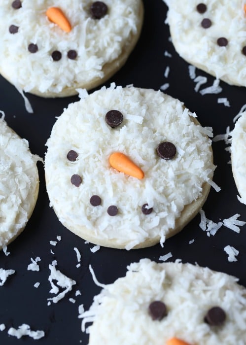Coconut Christmas cookies in the shape of snowmen.