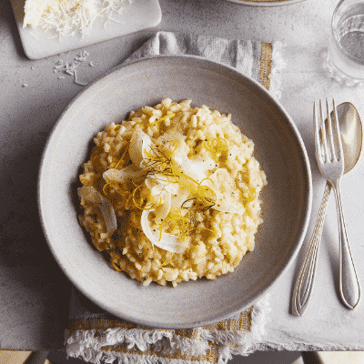 Risotto on a plate with cutlery.