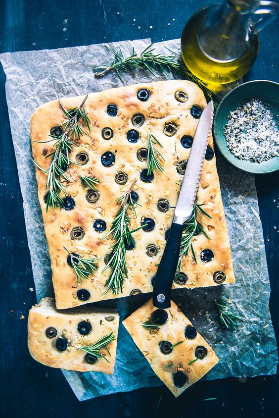 Baked bread with olives, rosemary and olive oil.
