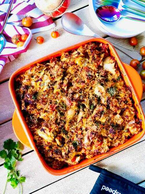 Cabbage, minced meat and fresh herbs baked in the oven, served in a baking dish.