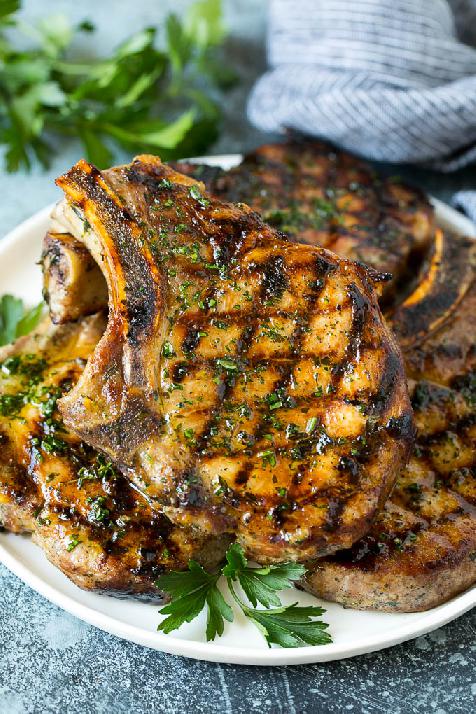 Grilled marinated chops, served on a plate.