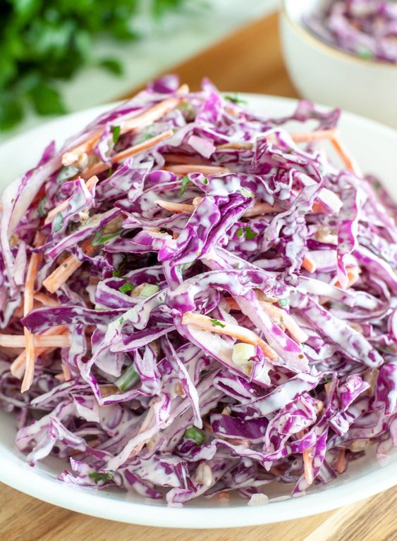 Red cabbage with mayonnaise, carrots and other spices.