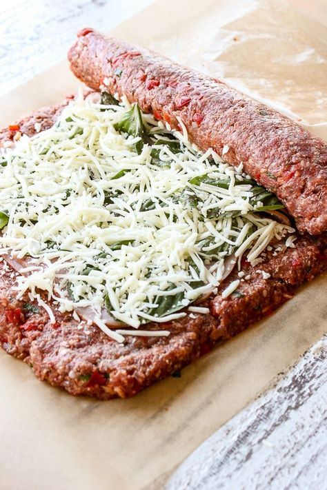 Minced meat roll filled with cabbage, cheese and bacon.