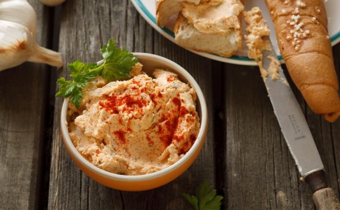 Bowl with brynza cheese and paprika spread.
