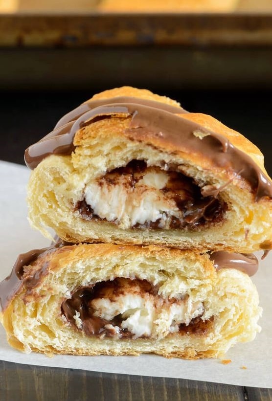 Fluffy puff pastry baked like a croissant filled with chocolate and cheese cream.