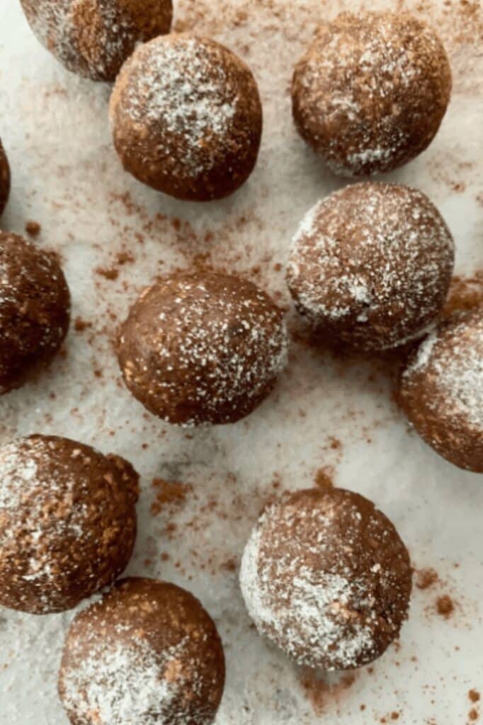 Light date balls with gingerbread taste and almonds inside.