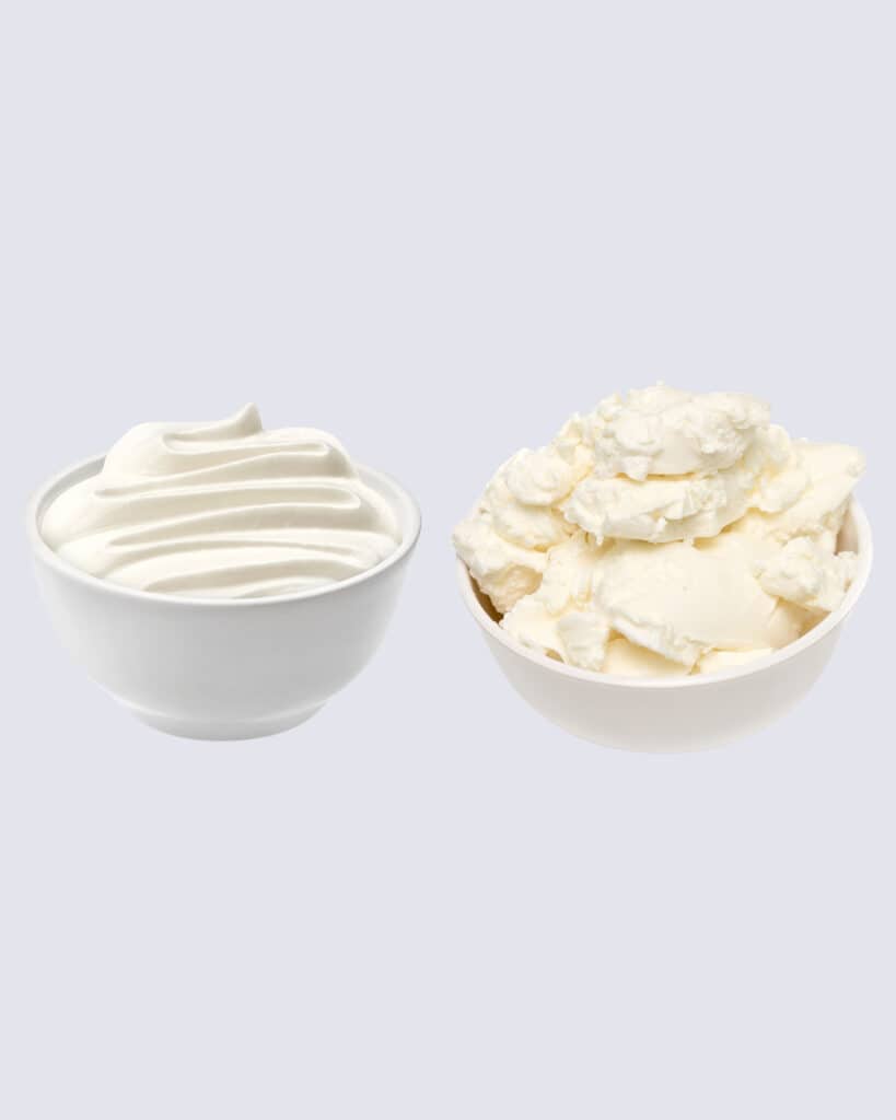 Creamy spreadable cheese in one bowl and mascarpone in another.