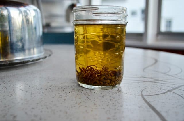 What a glass full of anise extract looks like.