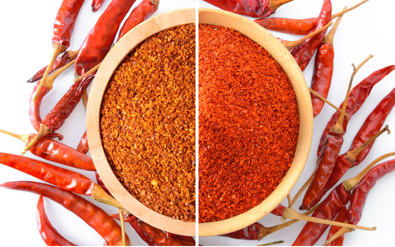The difference between cayenne pepper and chilies that are sprinkled in a bowl.