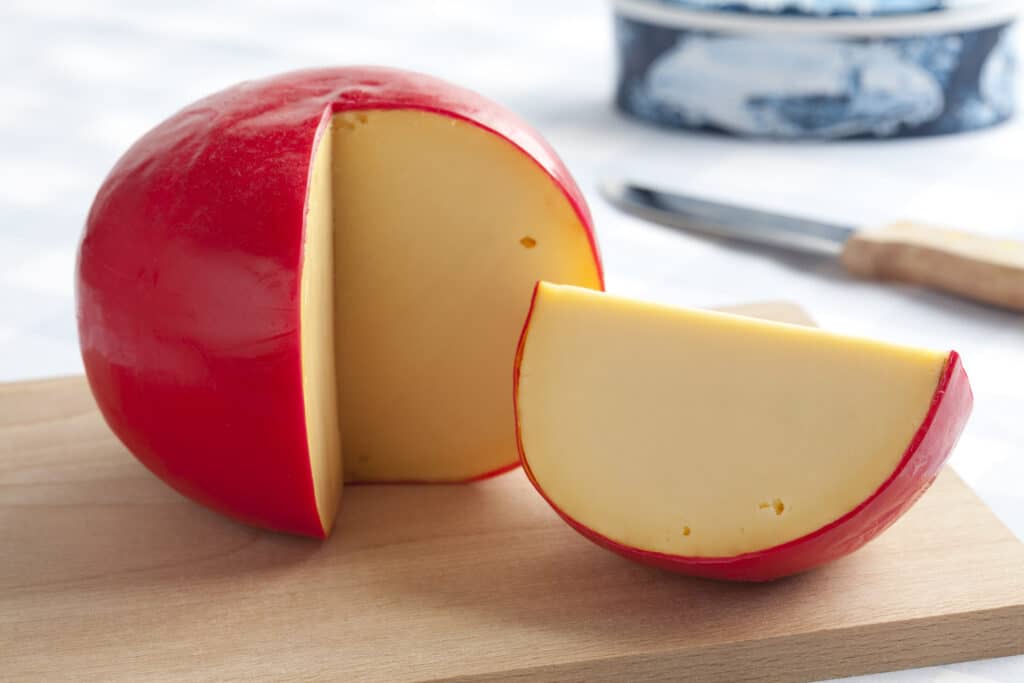 Real round Dutch cheese in red wax.