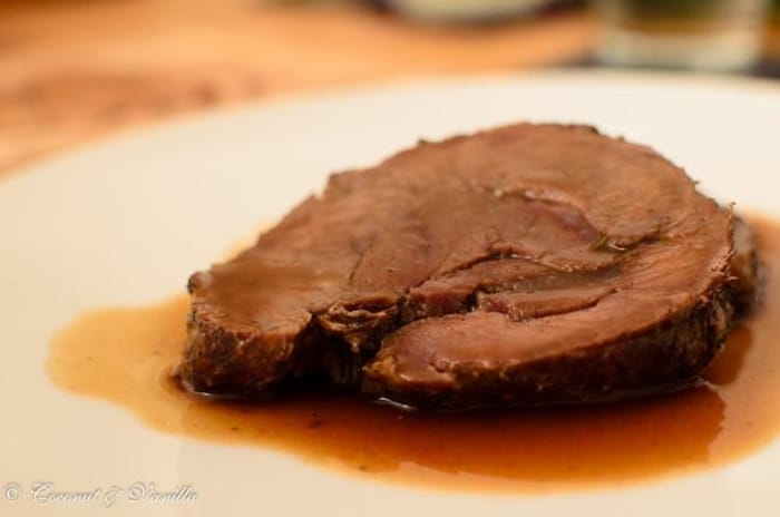 Slice of boar meat in rose hip sauce.