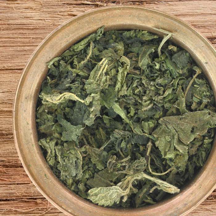 A bowl of dried nettle leaves.