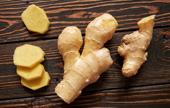 Fresh ginger whole and sliced.