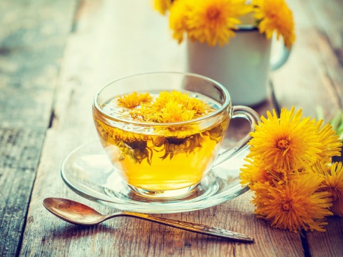 A cup of tea made from dandelion flowers.