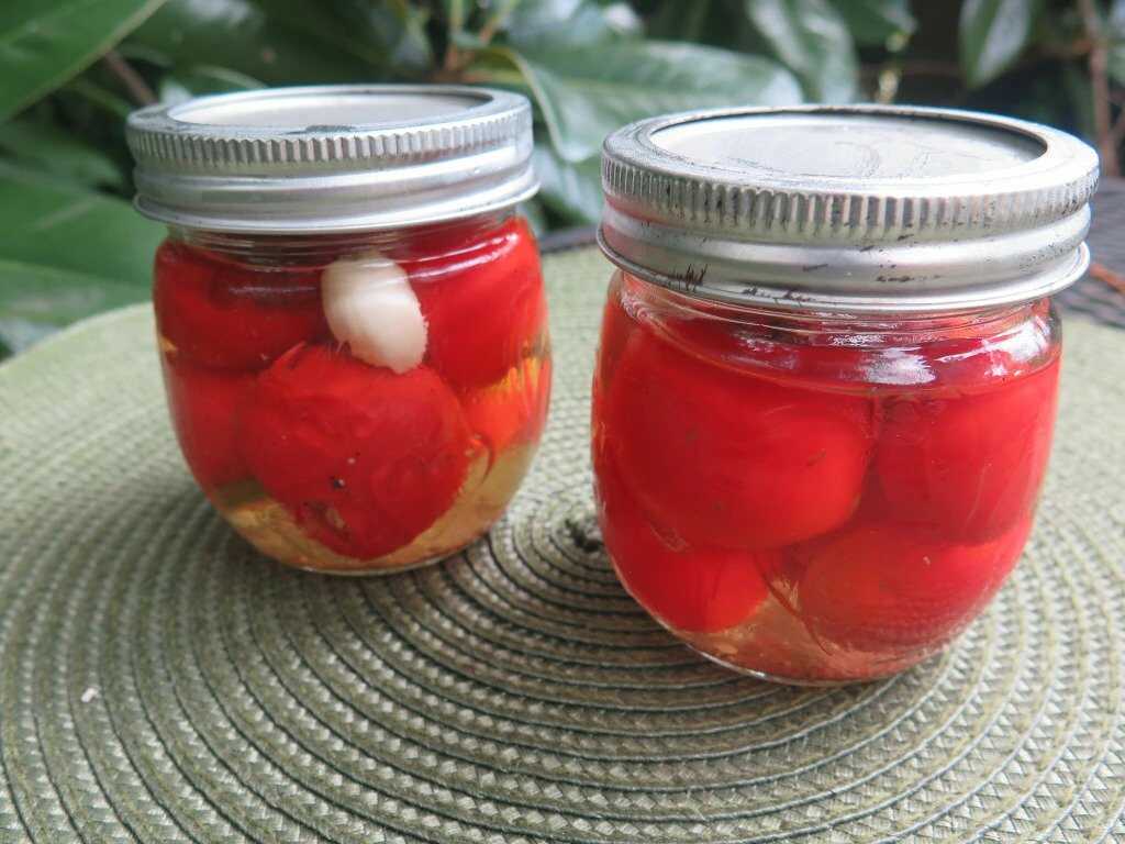 Pickled hot peppers in mason jars.