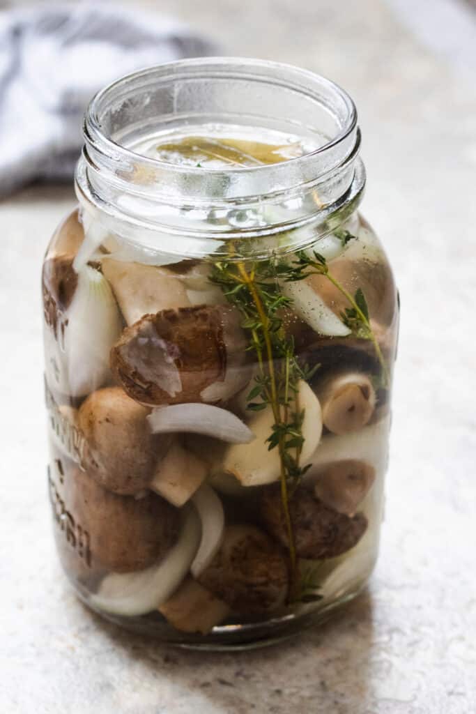 Pickled mushrooms in a jar.