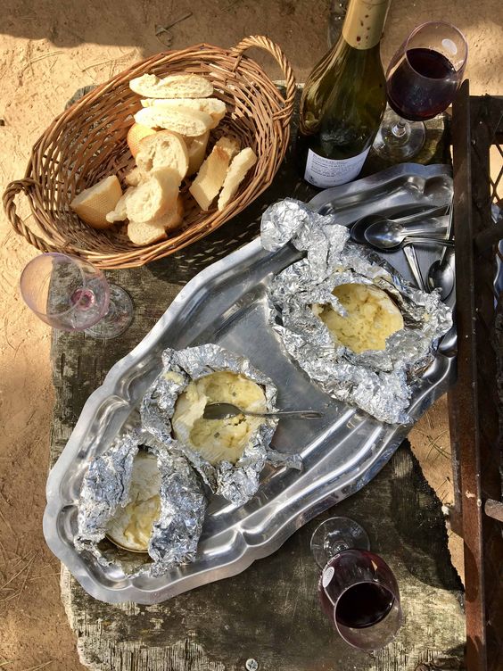 Cheese in foil served with wine.