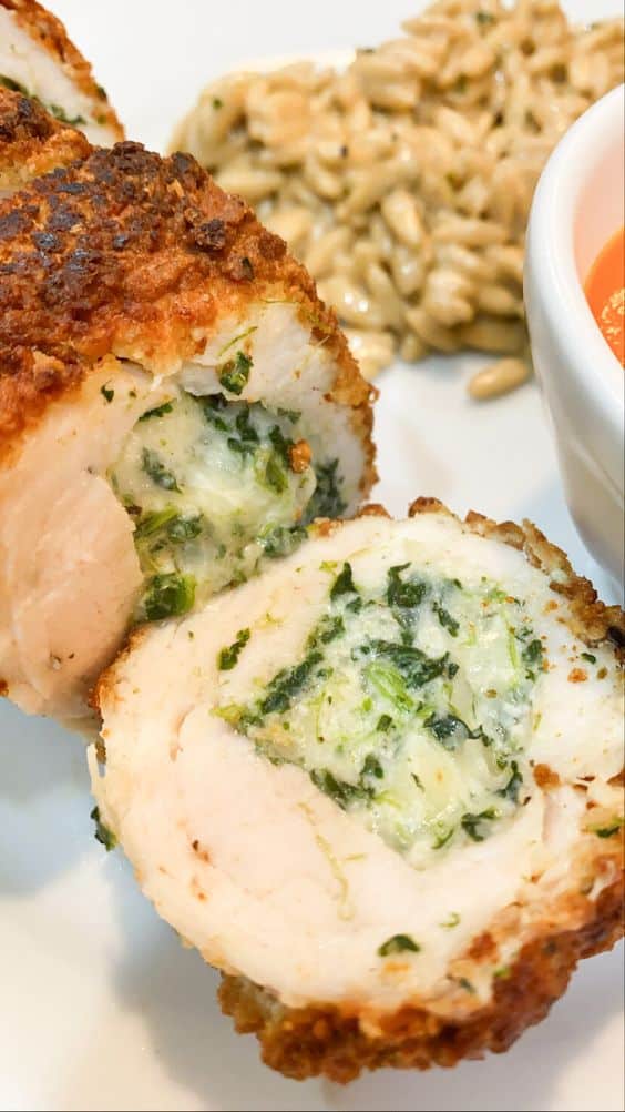 Sliced pieces of roulade filled with cheese and broccoli.