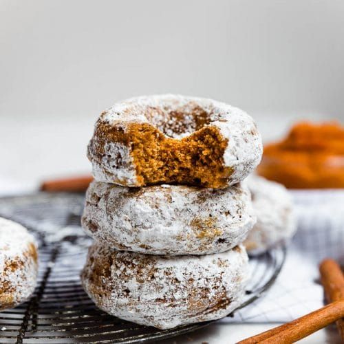 A mountain of fluffy donuts covered in sugar.