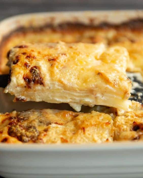 Layered potatoes baked with mild cheese.