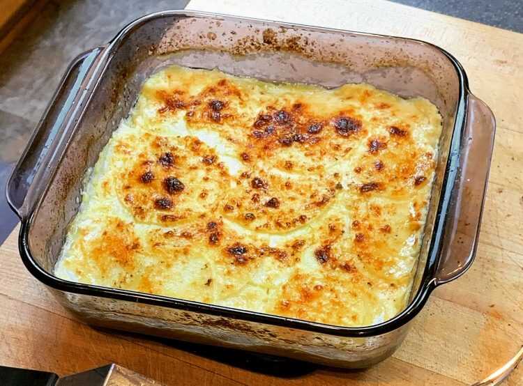Baked kohlrabi with cheese in a baking dish.