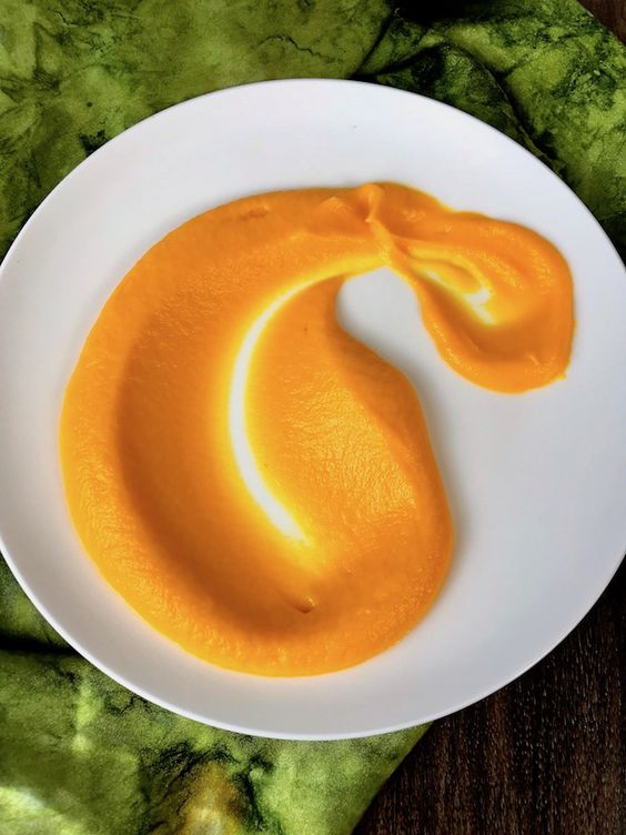 Plate with creamy carrot sauce.