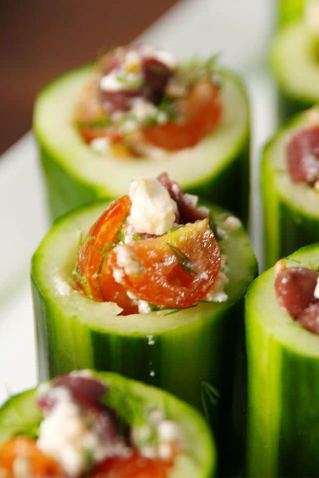 Cucumber pieces stuffed with vegetables and cheese.