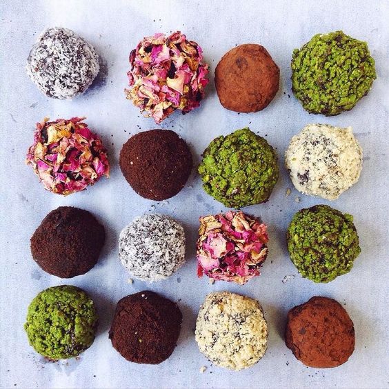 Sweet chocolate balls covered in various toppings.