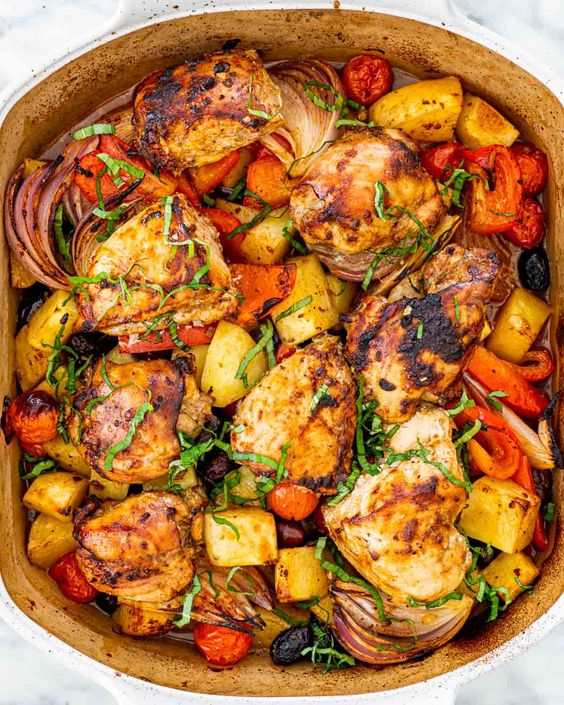 Chicken meat with vegetables and potatoes.