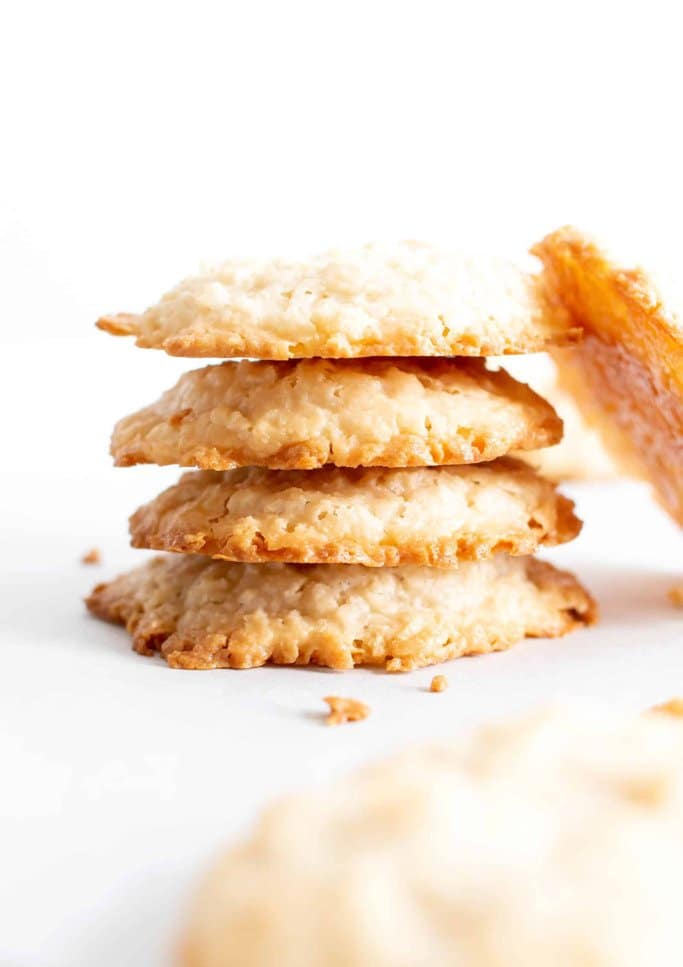Coconut cookies stacked on top of each other.