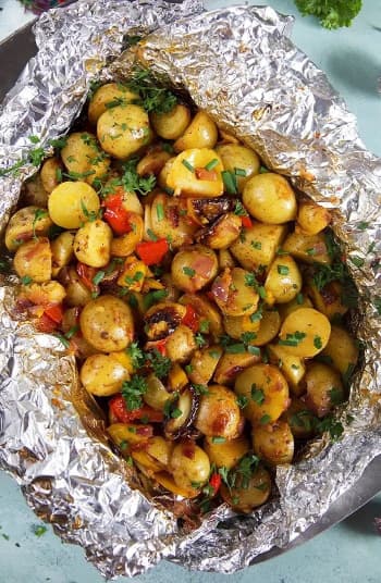 Grilled potatoes with vegetables in foil