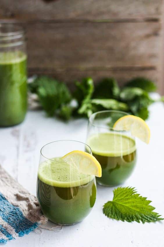 A glass full of nettle and citron drink.