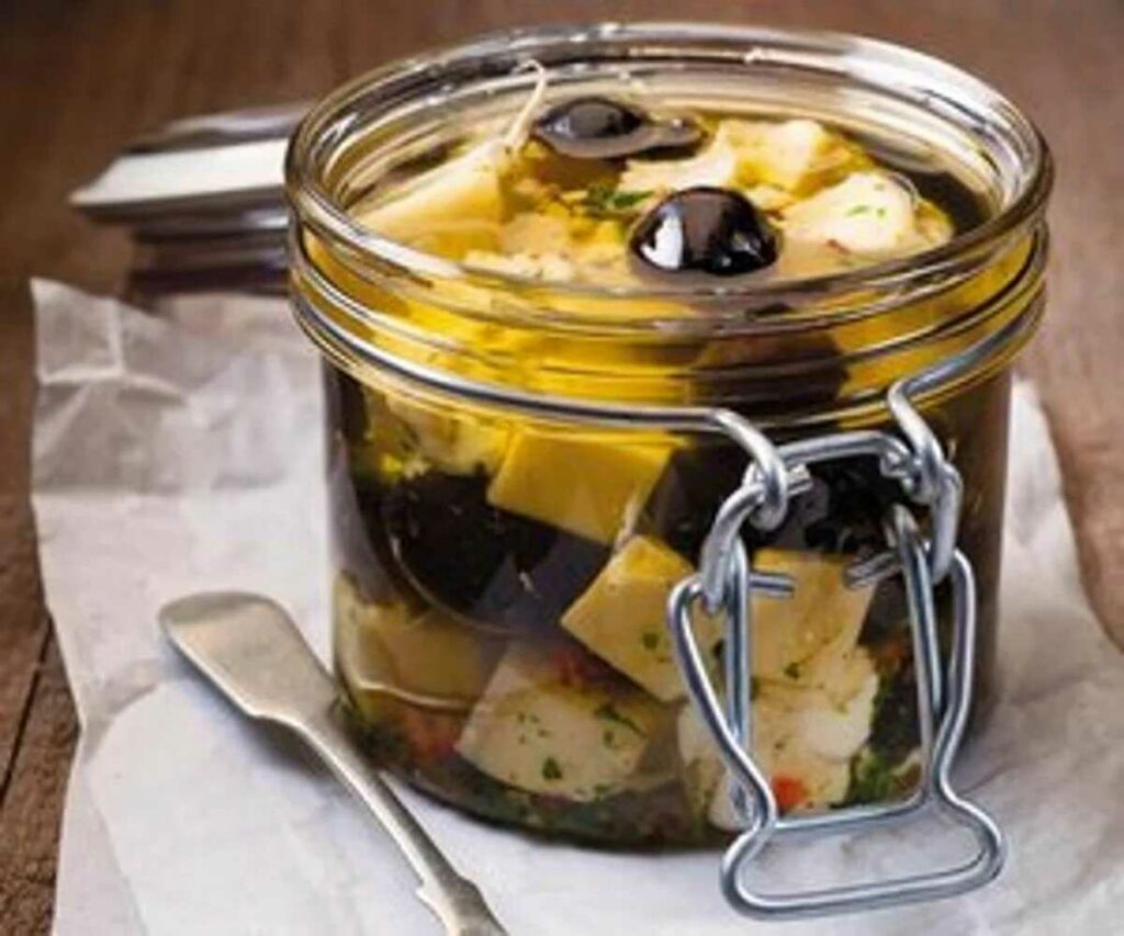 Balkan cheese loaded together with olives, garlic, chilli, paprika and herbs in a jar.