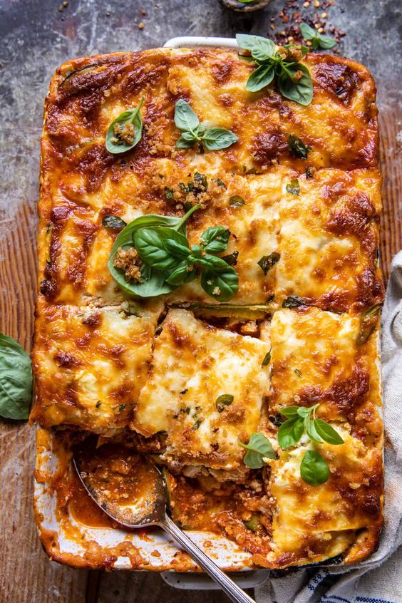 Beautifully baked, golden lasagna with zucchini, meat and tomato sauce.