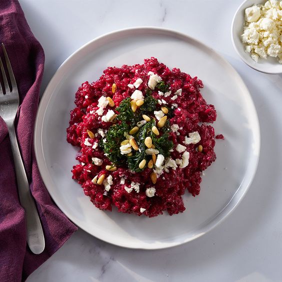 Crimson red risotto with parmesan and pine nuts.
