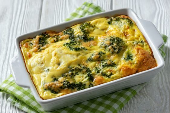 Perfectly baked lasagna with broccoli and meat with white sauce.