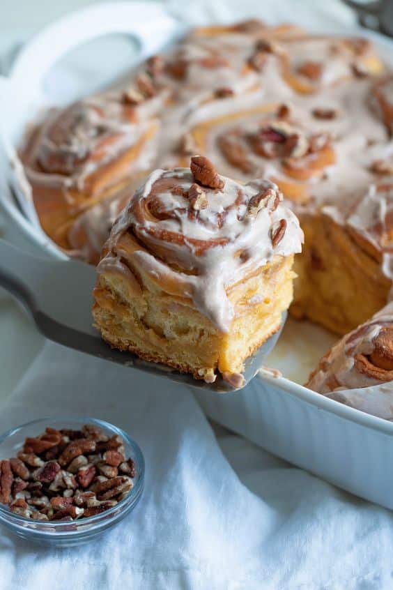 A baking dish full of fluffy cinnamon rolls made from fresh cheese.