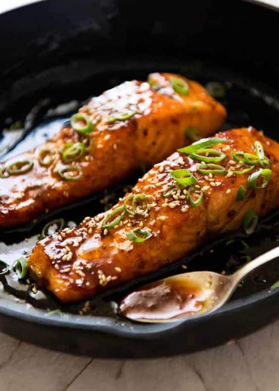 Delicious salmon coated in a sticky honey sauce with onions.