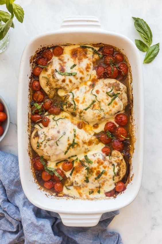 White oven-baked chicken with mozzarella and tomatoes.